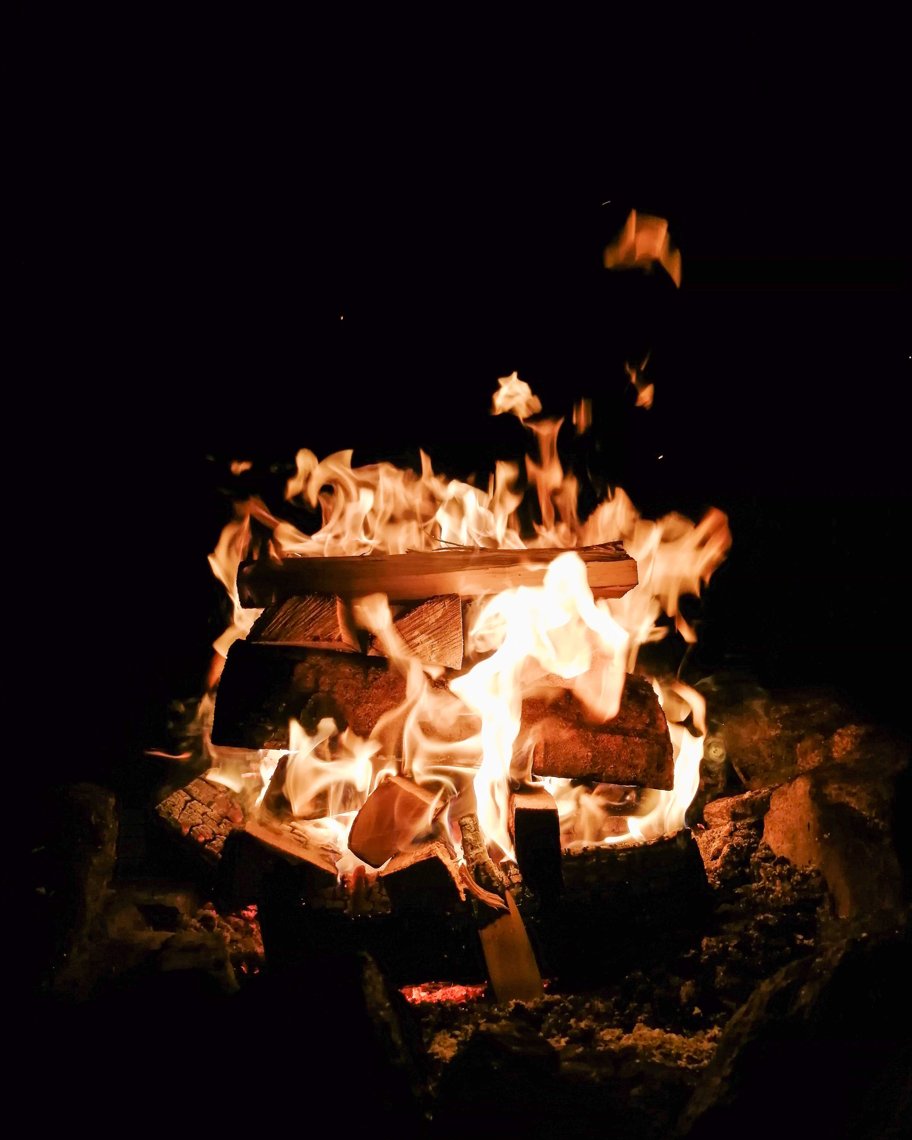 A campfire with a black background.